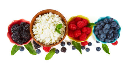 fresh cottage cheese and berries isolated on whiteの写真素材