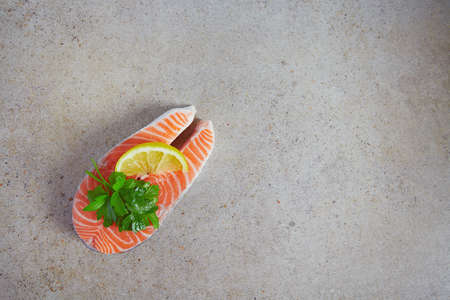fresh salmon stake on granite surfaceの写真素材