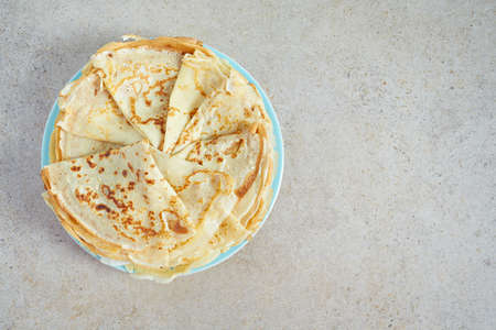 fresh crepes on stone background