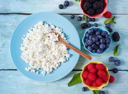 fresh berries and cottage cheeseの写真素材