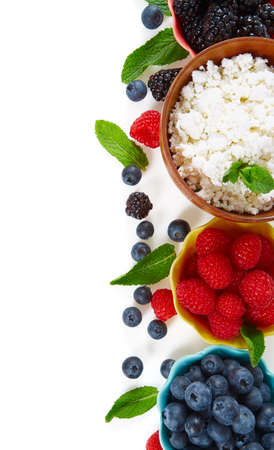 fresh cottage cheese and berries isolated on whiteの写真素材