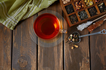 cup of warm tea on wooden surfaceの写真素材