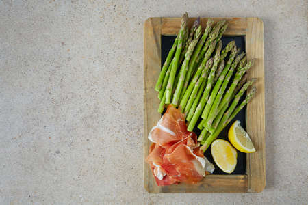 fresh green asparagus and jamon serranoの写真素材