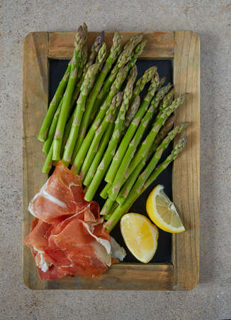 fresh green asparagus and jamon serranoの写真素材