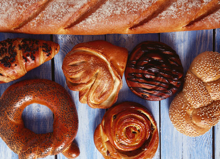 fresh buns on wooden surface