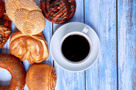 fresh buns and cup of black coffeeの写真素材