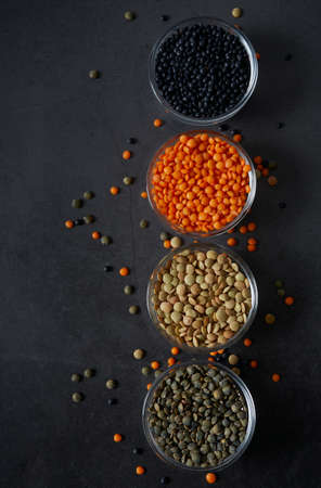 lentil assortment on black stone surfaceの写真素材
