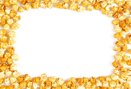 caramelized popcorn isolated on white backgroundの写真素材