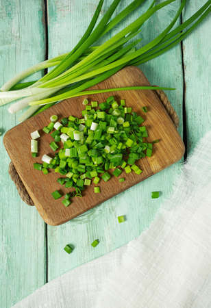 spring onion sliced for salad or seasoning on wooden surfaceの写真素材