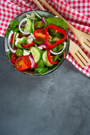 greek salad on grey stone surface, top viewの写真素材