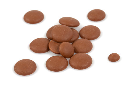 Tasty chocolate morsels isolated on white background.の写真素材