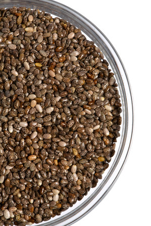 Chia seeds close up. Superfood concept. Isolated on white background. Top view.の写真素材
