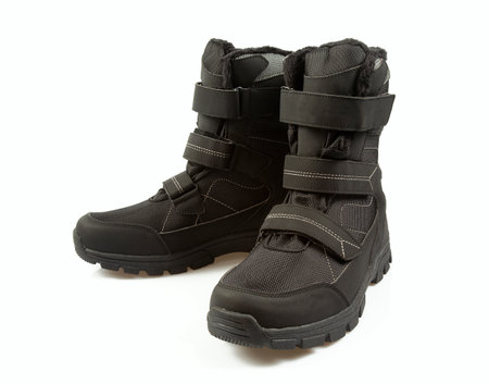 Pair of black winter boots isolated isolated on a white backgroundの写真素材