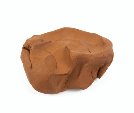 Natural clay piece isolated on white background. Wet clay material for sculpting or modeling.の写真素材