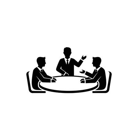 Three business people in suits are seated around a round table, engaged in a discussion, with one person gesturing.のイラスト素材