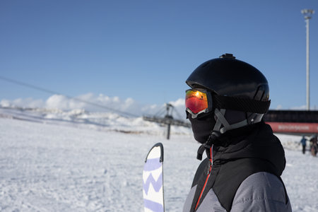 Close-up of a snowboarder with helmet and goggles.の写真素材