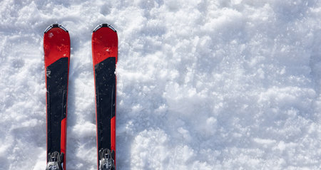 Two skis on white snow. Top view. Copy space.の写真素材