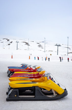 Sleds lined up against the backdrop of a ski slope. Winter holidays. Extreme sport. Vacation, travel content.の写真素材