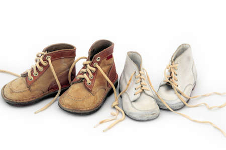 Vintage boy's & girl's baby shoes tied togetherの写真素材