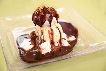 Vanilla ice cream with meringue & chocolateの写真素材