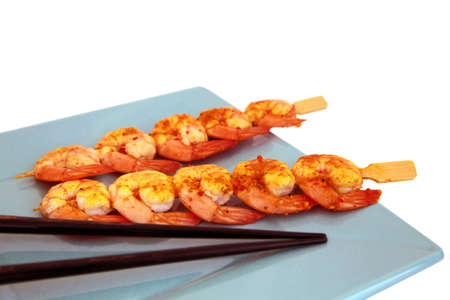 Shrimp Skewers on plate with chopsticksの写真素材