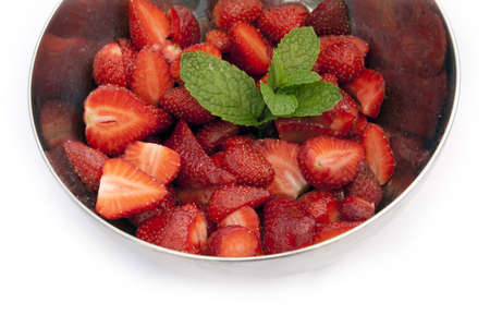 Strawberries in large metal bowlの写真素材