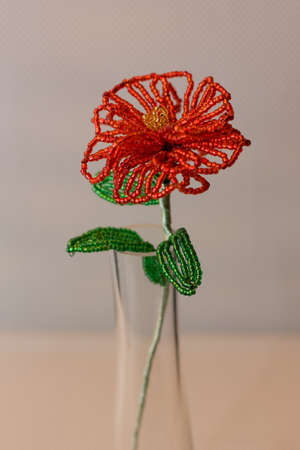 Handcraft bright rose made of red beadsの写真素材