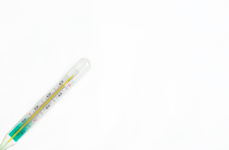thermometer on a white background. the temperature is high, the disease. doctor's tools. illness winterの写真素材