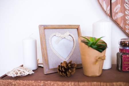 beautiful wooden photo frame in the shape of heart. beautiful interior details