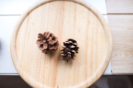 cones of spruce on a wooden board. cones lie on a background of wood.の写真素材
