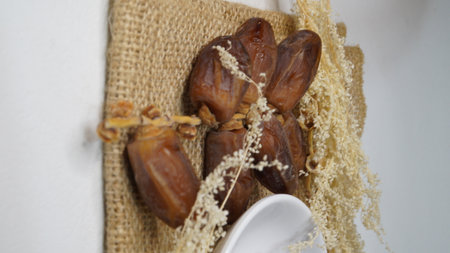 Date palm fruit on a white background. The concept of healthy food.