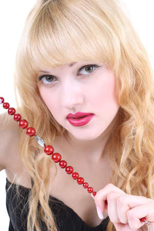 young woman with red lips and curly hairの写真素材
