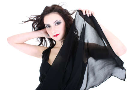 sexy woman with red lips and smoky eyes in black dress posingの写真素材