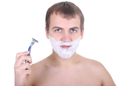 young man with  razor and shaving foam isolated over whiteの写真素材
