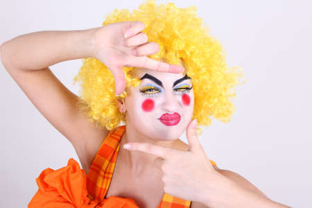 Happy clown in costume take a photoの写真素材