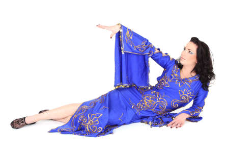 Woman in blue dress lying over white
