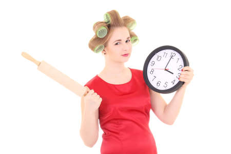 funny housewife with roller-pin and clock over white backgroundの写真素材