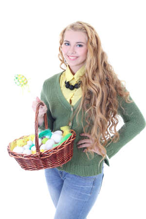 beautiful blondie girl with easter eggs in the basket over whiteの写真素材