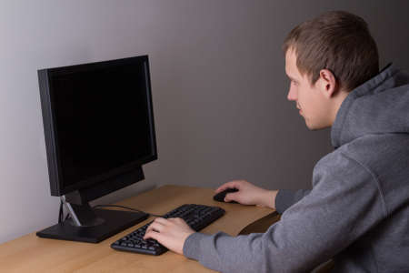 teenager using a computer at homeの写真素材
