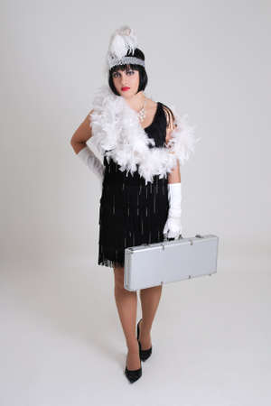 attractive woman in vintage clothes with case