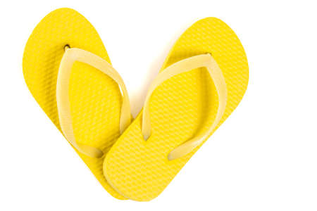 yellow beach flip flop shoes isolated on white backgroundの写真素材