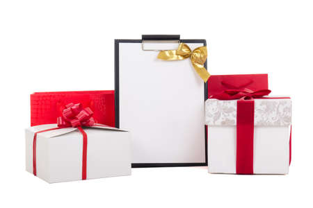 gift boxes with red ribbon and wish list isolated on white backgroundの写真素材