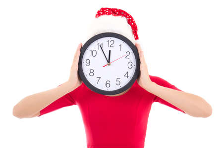 woman in santa hat holding clock over white backgroundの写真素材