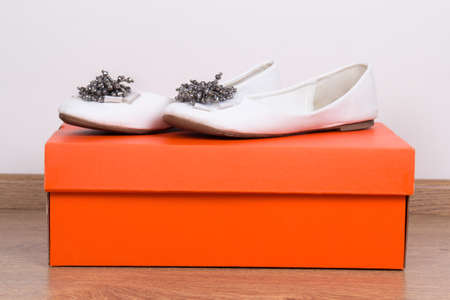 leather female summer shoes and orange boxの写真素材