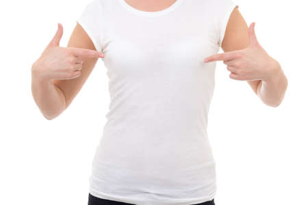 woman in blank white t-shirt showing at herself isolated on whiteの写真素材