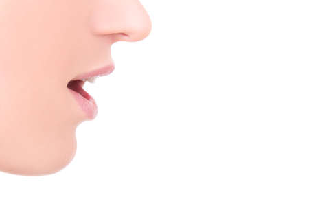 close up of female mouth isolated on white backgroundの写真素材