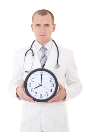 young male doctor with clock isolated on white backgroundの写真素材