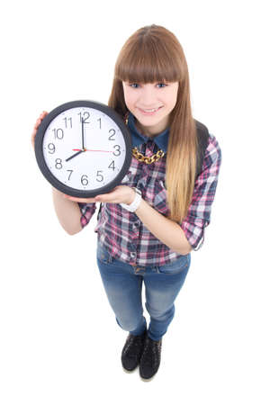 beautiful teenage girl with clock isolated on white backgroundの写真素材