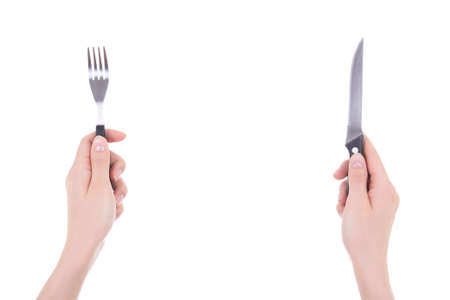female hands with fork and knife isolated on white backgroundの写真素材