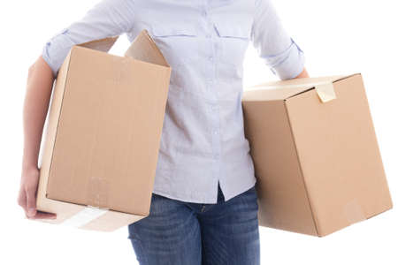 cardboard moving boxes in woman hands isolated on white background